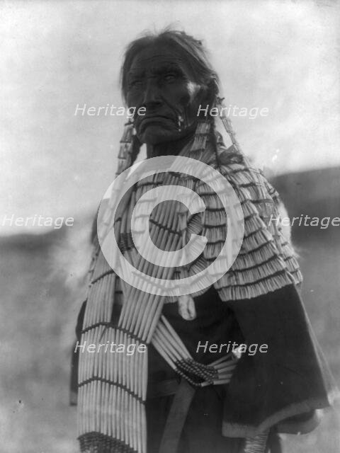 Slow Bull's wife, c1907. Creator: Edward Sheriff Curtis.