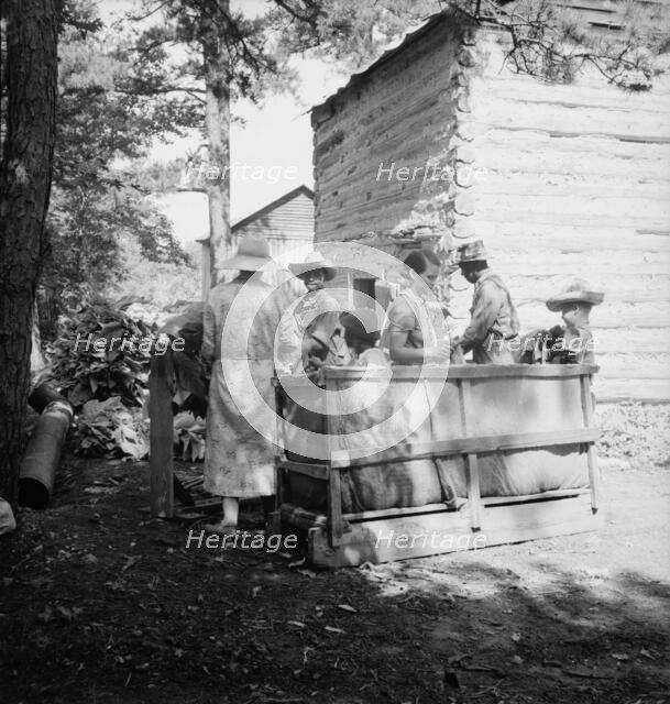 Families stringing tobacco brought in..., Granville County, North Carolina, 1939. Creator: Dorothea Lange.