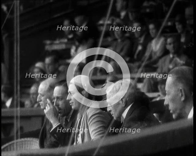Former King Alphonso of Spain and His Wife, Victoria Eugenie of Battenberg Watching Tennis, 1930s. Creator: British Pathe Ltd.
