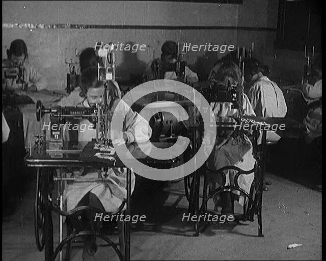 Young Female Civilians Operating Sewing Machines in an Arts Class, 1920. Creator: British Pathe Ltd.