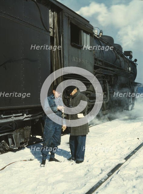Railroad conductor George E. Burton and engineer J.W. Edwards...Chicago, Ill., 1943. Creator: Jack Delano.