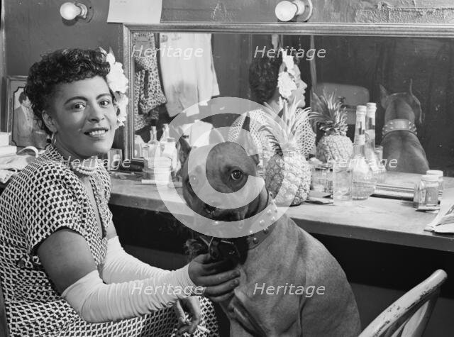 Portrait of Billie Holiday and Mister, Downbeat(?), New York, N.Y., ca. June 1946. Creator: William Paul Gottlieb.