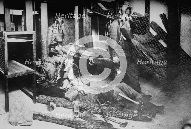 Oxygen helmets in mine rescues, between c1910 and c1915. Creator: Bain News Service.