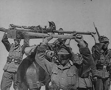 German Troops Carrying Equipment Through the Caucasus Mountains, 1943. Creator: British Pathe Ltd.