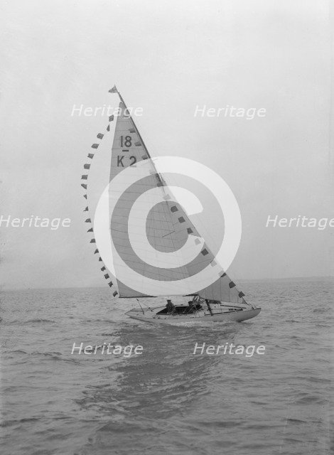 The 18-foot keelboat 'Prudence' (K2) with prize flags, 1922. Creator: Kirk & Sons of Cowes.