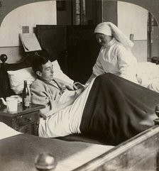 A soldier writing a letter in hospital, World War I, 1914-1918.Artist: Realistic Travels Publishers