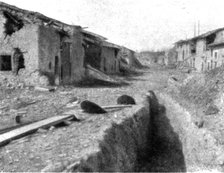 'Aspects du champ de bataille de Verdun; route traversant le village dispute de Cumieres..., 1916. Creator: Unknown.