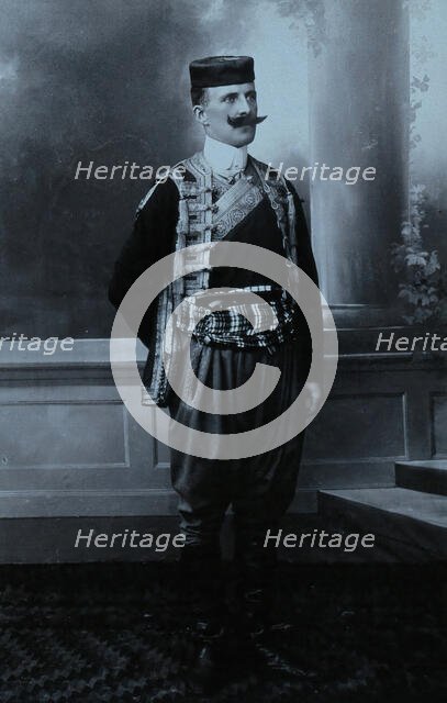 A Montenegrin man wearing national dress and a Montenegrin cap. Creator: Unknown.