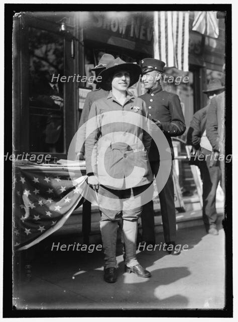 Dora Rodrigues, recruiter for service branches, possibly in front of the Cosmos Theater..., May 1917 Creator: Harris & Ewing.