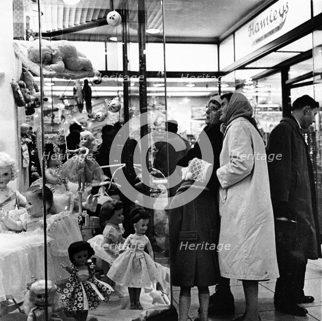 Shoppers window shopping in London, c1960. Artist: Unknown