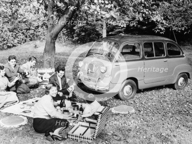 People enjoying a picnic beside a 1956 Fiat 600 Multipla, (c1956?). Artist: Unknown