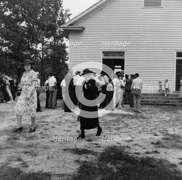 Congregation leaving for home after services, Wheeley's Church, Person County, North Carolina, 1939. Creator: Dorothea Lange.