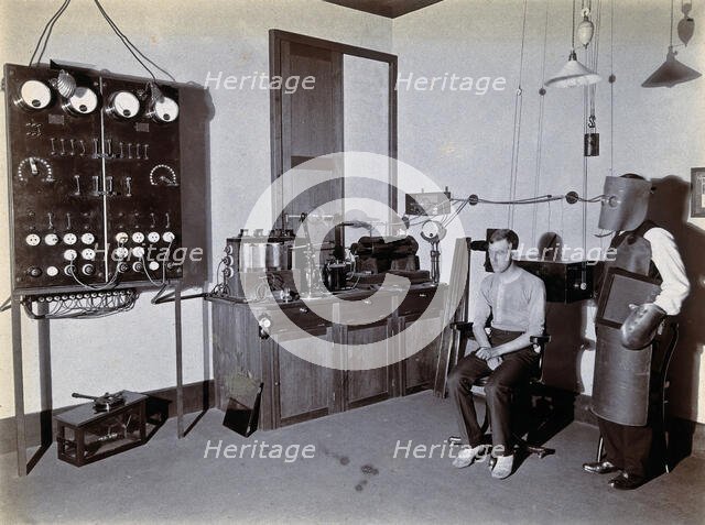 Johannesburg Hospital, South Africa: man in heavy apron, face mask and glove, possibly..., c1905. Creator: Unknown.