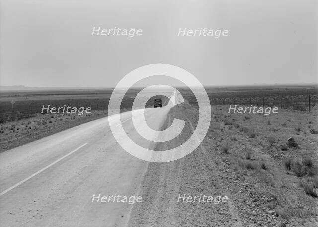 The highway going West, U.S. 80 near Lordsburg, New Mexico, 1938. Creator: Dorothea Lange.
