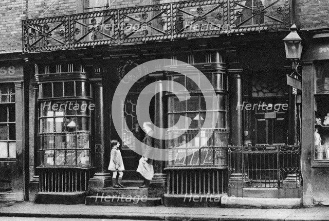 A shop front, Artillery Lane, off Bishopsgate, London, 1926-1927.Artist: McLeish