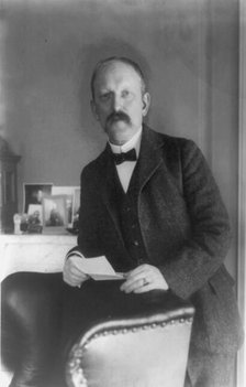 William Woodville Rockhill, half-length portrait, standing, facing left, between 1890 and 1910. Creator: Frances Benjamin Johnston.