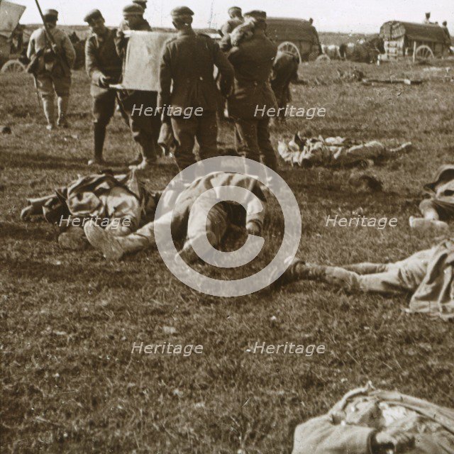 Burying bodies, Sainte-Marie-à-Py, northern France, c1914-c1918. Artist: Unknown.