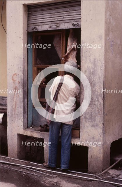 Tiny butcher's shop, McLeod Ganj, Dharamsala, India, 1988.  Creator: Amanda Waite.