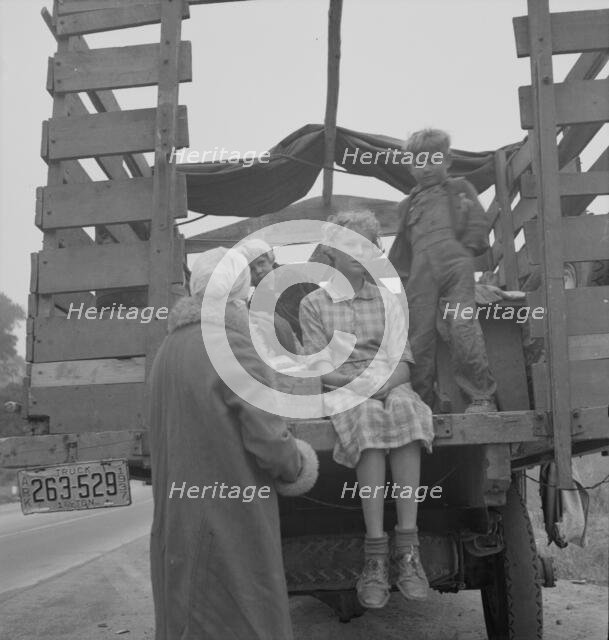 Family of ex-sharecroppers from Arkansas, near Little Rock, on California highway, 1937. Creator: Dorothea Lange.