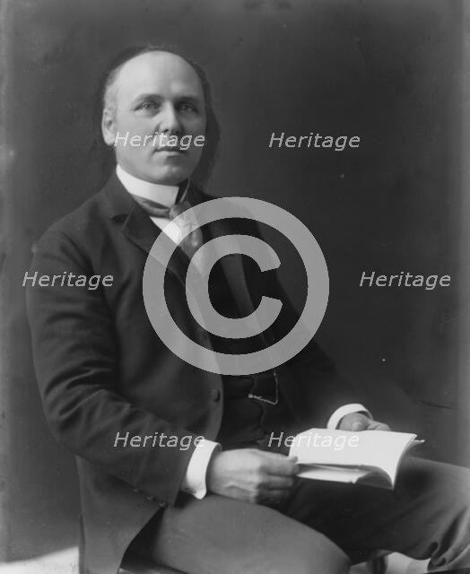 Howard Pyle, three-quarter length portrait, seated, facing slightly right, c1897. Creator: Frances Benjamin Johnston.