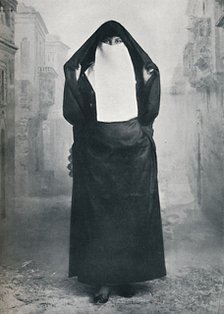 A Turkish lady in outdoor costume, 1912. Artist: Lekegian & Co.