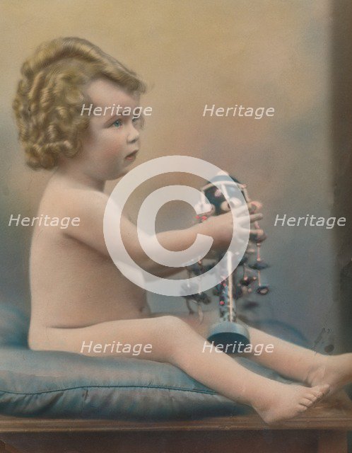 Child with toy, c1920. Artist: Unknown.