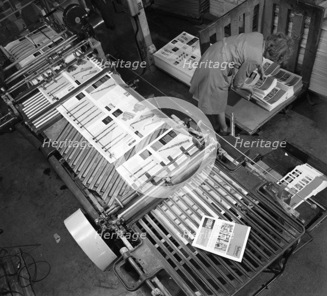 Stacking finished brochures at a printers, Mexborough, South Yorkshire, 1959. Artist: Michael Walters