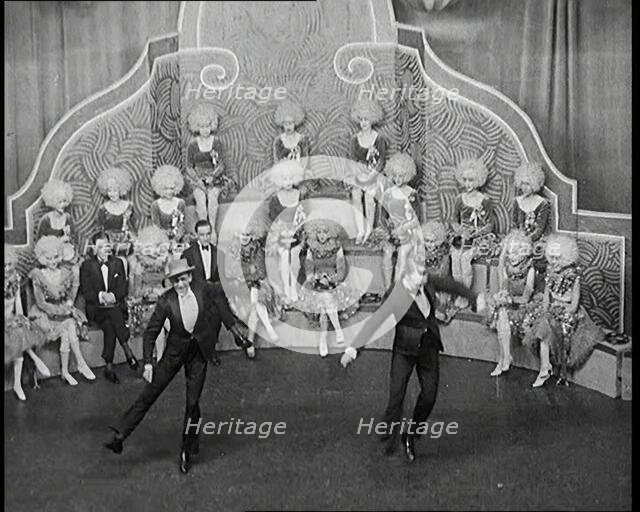 Male and Female Actors in Costumes Performing a Dance Routine On Stage, 1920s. Creator: British Pathe Ltd.