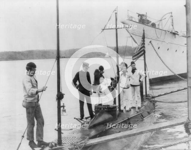 U.S. Naval Academy, Annapolis, Md. 1902?: going aboard the training submarine, (1902?). Creator: Frances Benjamin Johnston.