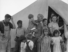 In FSA migrant labor camp during pea harvest, Brawley, Imperial County, California, 1939. Creator: Dorothea Lange.