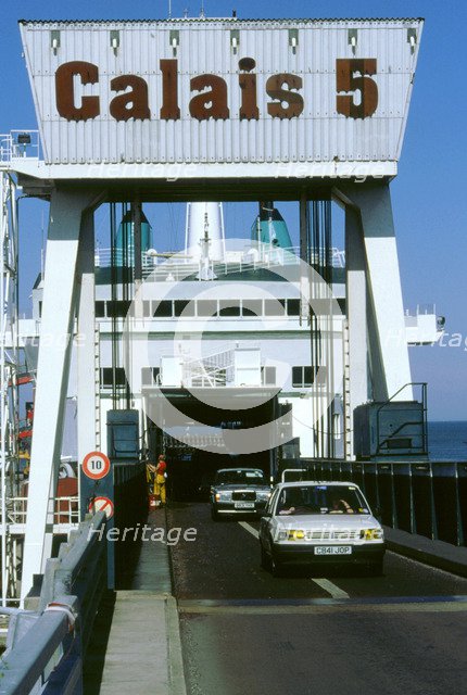 Cars boarding ferry at Calais. Artist: Unknown.