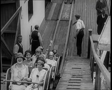 A Large Group of Female Civilians Enjoying  a Roller Coaster Ride, 1926. Creator: British Pathe Ltd.