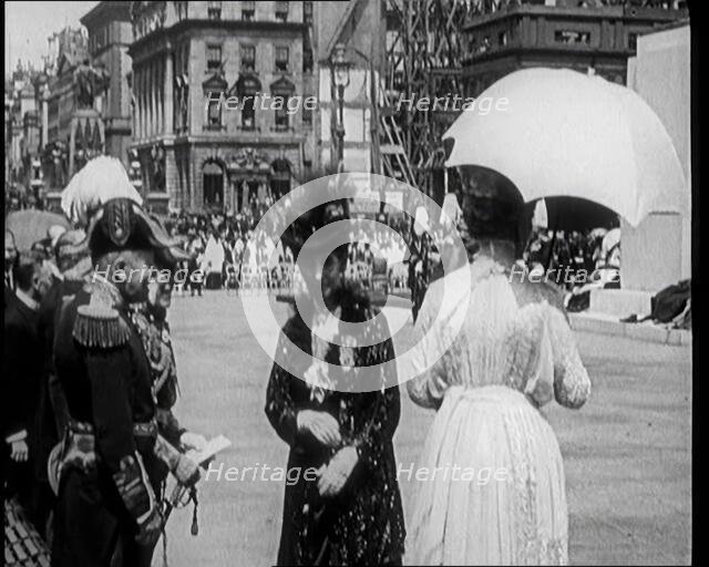 Queen Alexandra Shaking Hands With Male Officers Next to Queen Mary, 1921. Creator: British Pathe Ltd.