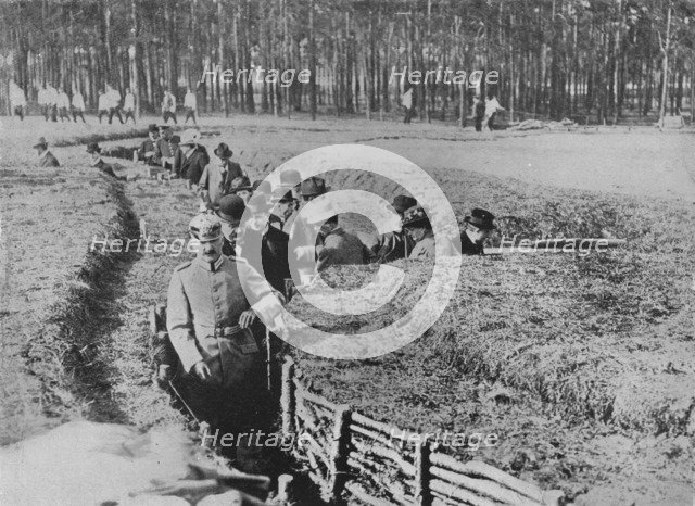 'Showing civilians round the exhibition trenches on the outskirts of Berlin', 1915. Artist: Unknown.