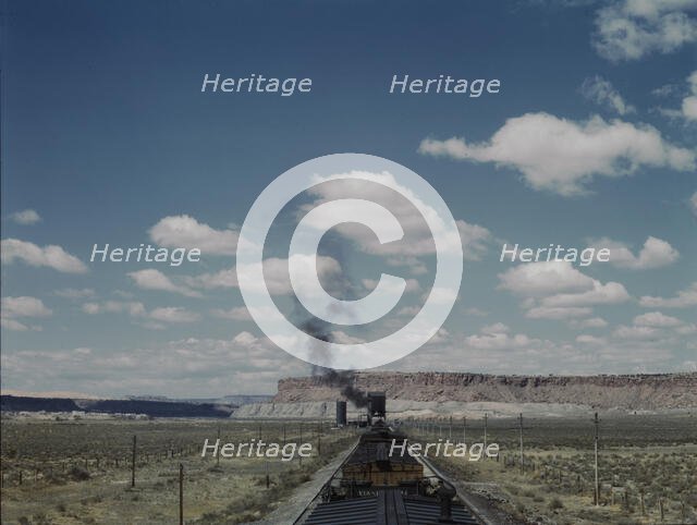Santa Fe R.R. train stopping for coal and water, Laguna, New Mexico, 1943. Creator: Jack Delano.