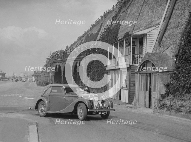 MG VA Tickford tourer of Lilian Roper competing in the RAC Rally, Madeira Drive, Brighton, 1939. Artist: Bill Brunell.