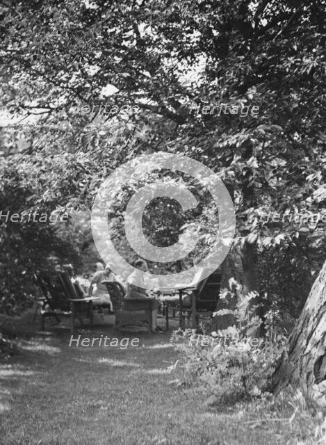 Tea in the Griffin or Nissen Garden, 1931 June 14. Creator: Arnold Genthe.