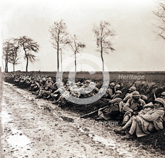 Troops resting by the side of a road, northern France, c1914-c1918. Artist: Unknown.