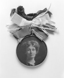 A silver and glass badge with a medallion portrait of Emmeline Pankhurst, c1908. Artist: Unknown