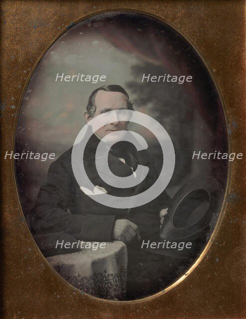 Man Wearing Coat and Gloves, Holding Hat, Seated in Front of Painted Outdoor Backdrop, 1840s. Creator: Attributed to Samuel Broadbent Jr..