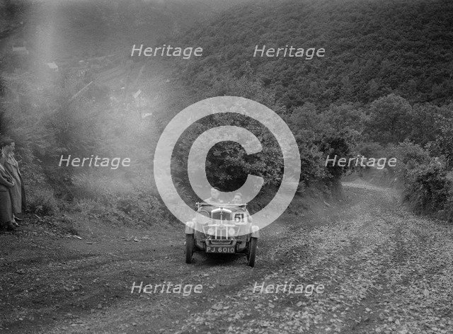 Wolseley Hornet competing in the Mid Surrey AC Barnstaple Trial, Beggars Roost, Devon, 1934. Artist: Bill Brunell.