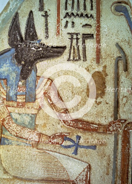 Detail of god Anubis in a familiar stela from a chapel of worship.