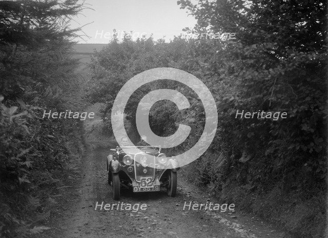 Singer open 2-seater competing in the Mid Surrey AC Barnstaple Trial, 1934. Artist: Bill Brunell.