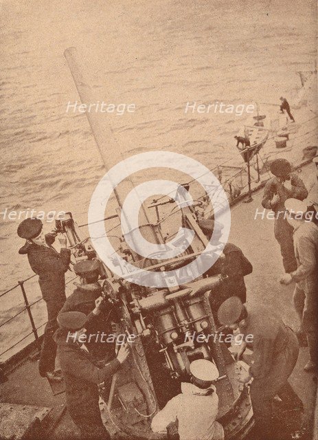 An anti-aircraft gun in action on a British battleship, c1917 (1919). Artist: Unknown.