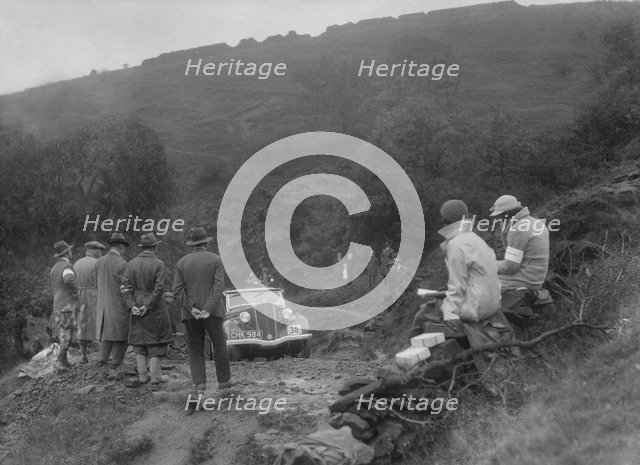 Ford 10 tourer of J McEvoy competing in the MCC Sporting Trial, 1935. Artist: Bill Brunell.