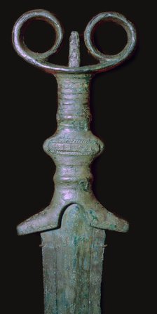 Hilt of an early bronze sword, 7th century BC.