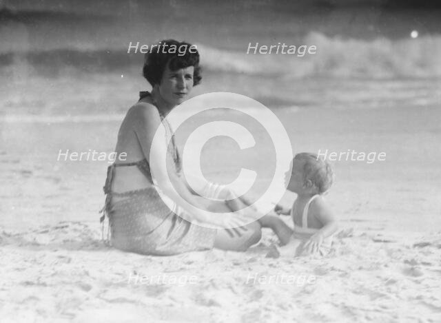 Mrs. George Eustis and child, at the beach, between 1911 and 1942. Creator: Arnold Genthe.
