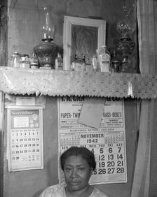 Negro woman in her home, Washington (southwest section), D.C., 1942. Creator: Gordon Parks.