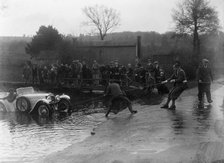 1935 Frazer-Nash TT replica being pulled out of a ford during a motoring trial, 1936. Artist: Bill Brunell.