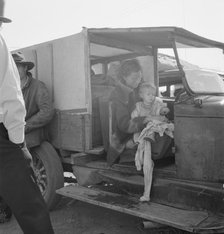 Mother and baby of family on the road, Tulelake, Siskiyou County, California, 1939. Creator: Dorothea Lange.